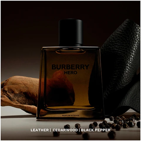 Image 1 - A dark, moody image of a Burberry Hero perfume bottle, featuring a rectangular design with a black cap, surrounded by leather, wood, and black peppercorns, with visible text reading Burberry HERO PARFUM INTENSE and Leather | Cedarwood | Black Pepper.
              Image 2 - Image shows various Burberry fragrance bottles labeled Eau de Toilette, Eau de Parfum, Parfum, and Parfum Intense, with descriptions of their scents and intensity levels displayed below each bottle, along with images of natural elements like wood and leaves; visible text includes Burberry HERO and information about scent notes and intensity.
              Image 3 - A brown glass perfume bottle labeled Burberry Hero 100ml is on the left, next to a refillable brown container labeled Burberry Hero Refill 200ml on the right, both set against a dark background.
              Image 4 - An instructional image showing three steps to refill Burberry Hero bottles: step 1 is unscrewing the pump, step 2 is screwing the refill onto the bottle cap, and step 3 indicates that the bottle will refill automatically, with a note that refills are available on 100ml bottles only.
              Image 5 - A shirtless man with tousled hair is sitting on a horse by the water, with a perfume bottle in the foreground displaying the text Burberry Hero and The New Parfum Intense.